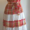 13.5Robe madras pour les cérémonies. Tissu tout en coton. Elastique à la taille.Une ceinture est livrée avec la robe. Cette superbe robe a été confectionnée à Paris et différentes tailles disponibles sont proposées : S, M, L, XL.