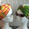 14.1Bandeau en tissu Wax et Madras aux couleurs orangées et verdoyantes sur une combinaison de deux pièces. Prix : 27€. Confectionné par Anjero Création.