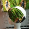 14.4Bandeau en tissu Wax et Madras aux couleurs orangées et verdoyantes sur une combinaison de deux pièces. Confectionné par Anjero Création.