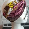 15.3Bandeau en tissu Wax sur une décoration évoquant des ombres alignées sur un fond tricolor. Dimension : 38cm sur 41cm. Confectionné par Anjero Création.