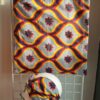 6.2Tote-bag en tissu Wax sur une décoration évoquant vagues et coquillages aux couleurs d'été assorti d'un même bandeau aux mêmes couleurs et décorations. Dimension : 38cm sur 41cm. Confectionné et créé par Anjero Création.