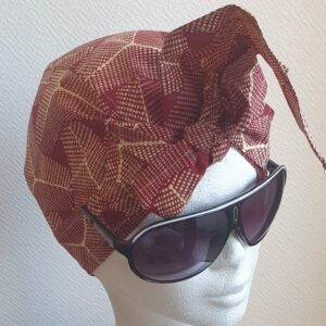 5.1Turban pleine tête en coton wax alliant les couleurs rose framboise et rose dragée. Ce couvre-chef apparenté tout à fait original dispose d'une parfaite élasticité à l'arrière pour une adaptation idéale. Ce dernier est entièrement conçu et réalisé aux ateliers AnjeroCréation  à Paris. Prix : 19.95€.